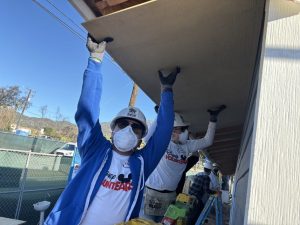 Disney VoluntEAR working on house