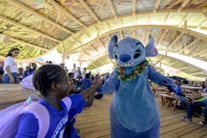Stitch high-fives child in South Eleuthera