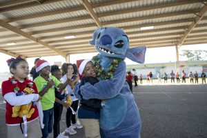 Stitch hugs child at Port Canaveral school