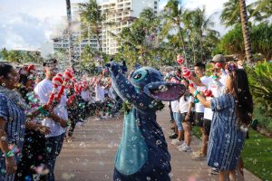 Stitch celebrates with bubbles at Disney VoluntEARS at Aulani, A Disney Resort