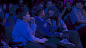 kids talk to each other while seated for screening