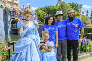 Wish kid Lilo posing with Cinderella and her family