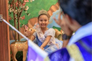 wish kid Lilo poses in Cinderella dress