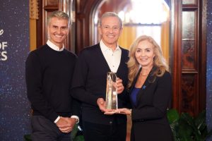 Bob Iger and Disney CEO Josh D'Amaro pose with Leslie Motter, president and CEO of Make-A-Wish America