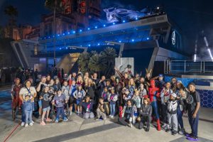 make a wish kids pose with avengers and creators at Disney's California Adventure Avengers Campus