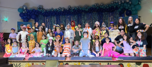 kids pose on stage for Finding Nemo musical