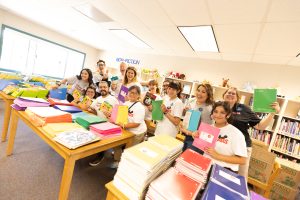 Disney VoluntEARS pose in classroom