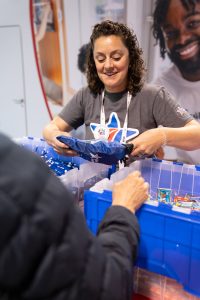 Blue Star Families rep helps D23 guest pack a bag