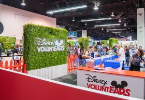 wide shot of D23 guests participating at Disney VoluntEARS Pavillion