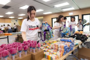 Disney VoluntEARS backs a bag of school supplies