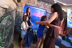 Catherine Laga'aia, star of live action Moana, hugs child
