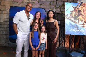 Catherine Laga'aia and Dwayne Johnson pose with GOSH family