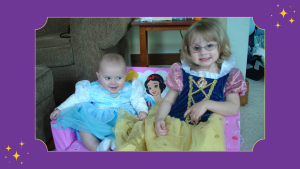 baby Ella and young Libby wearing princess dresses with purple World Princess Week border