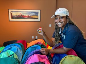 woman smiling with backpacks